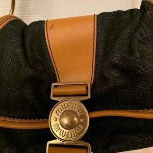 Miu Miu Denim and brown leather bag.